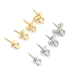 Detail of gold and silver stainless steel screw eye bail peg caps for pearl jewelry