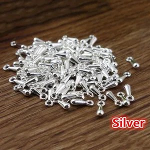 Silver teardrop chain pendants for DIY jewelry making on dark wooden background