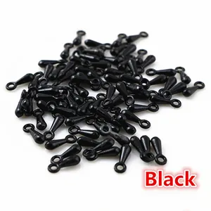 Bulk pack of black alloy teardrop charms for jewelry making and chain ends on white background
