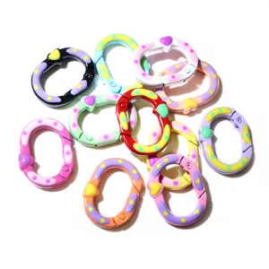 Close-up of colorful heart-patterned plastic lobster clasps for DIY jewelry making