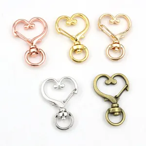 Set of heart-shaped rotating lobster clasps in gold, silver and bronze metal finishes
