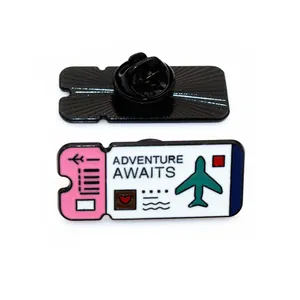 Adventure Awaits enamel pin with airplane ticket design and butterfly clutch back