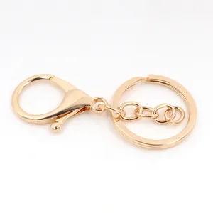 Close-up of a polished gold lobster clasp and split key ring for DIY jewelry making