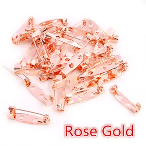 Close-up of rose gold DIY safety pin findings with multi-hole base for brooch making