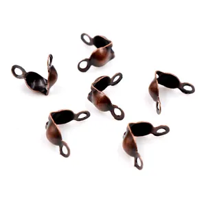 Macro shot of vintage copper bead tips calottes for DIY jewelry making and end connection