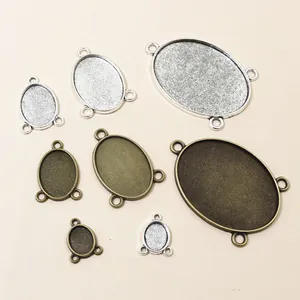 Ovalen hangerbasissen van legering in zilver en brons voor DIY sieraden maken accessoires