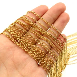 Golden plated stainless steel chain assortment in hand for DIY jewelry making and necklaces