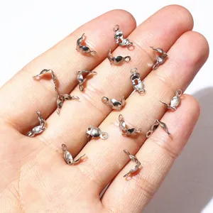 Stainless steel double loop foldover connectors for DIY jewelry making shown in hand