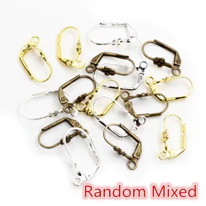 Macro detail of mixed lever back earring hooks in gold, silver, and bronze finishes