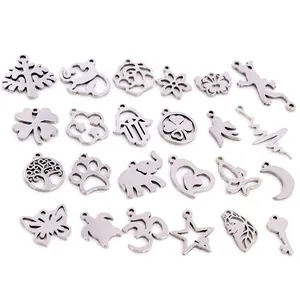 Various stainless steel DIY jewelry pendants including tree, moon and star charms