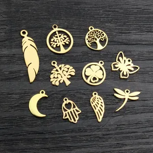 Golden vacuum plated stainless steel charms including feather, moon, and butterfly shapes