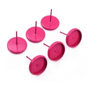 Macro view of six matte rose pink 10mm tray stud earring bases for DIY jewelry making