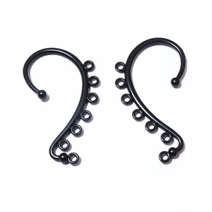 Macro detail of matte black S-shaped ear hook accessories with seven hanging rings