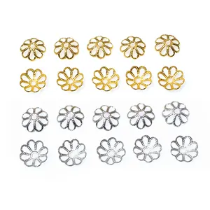 Detailed macro view of 20 pieces hollow flower bead caps in gold and silver stainless steel