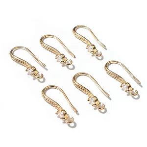 Macro shot of 6 gold plated copper ear hooks with cubic zirconia for DIY jewelry making