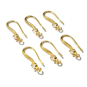 Detail of DIY earring hooks in gold plating with sparkling cubic zirconia stones