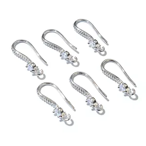 Detailed view of silver zircon-encrusted ear hooks for professional jewelry making
