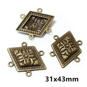 Macro detail of antique bronze diamond connectors for DIY jewelry making 31x43mm