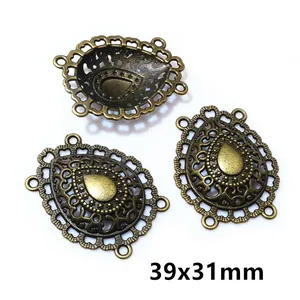 Macro view of 39x31mm antique bronze teardrop connectors for DIY jewelry making