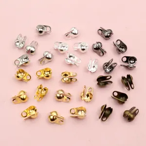 Detailed close-up of multi-color metal calotte crimp bead ends for DIY jewelry making