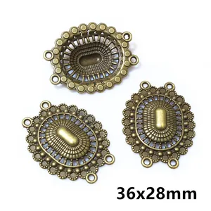 Detail of vintage bronze oval multi-hole jewelry connectors measuring 36x28mm