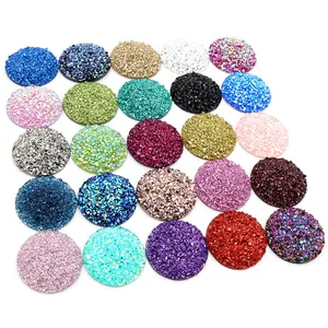 Macro detail of colorful round glitter resin cabochons with textured crushed stone surface