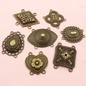 Set of vintage bronze alloy connectors with floral engraving for DIY jewelry making