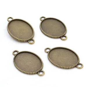 Lot de quatre bases de pendentif ovales en bronze antique de 18x25mm de diamètre