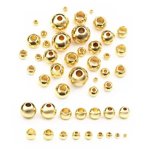 Detailed comparison of various sizes of gold plated stainless steel spacer beads with holes