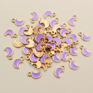 Macro shot of light purple moon pendants for DIY jewelry with gold metal edges