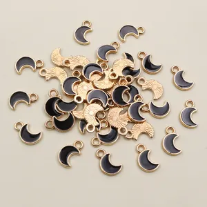Golden and black enamel crescent moon pendants with connecting rings for DIY jewelry
