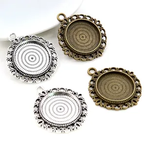 Vintage 20mm round alloy pendant trays with lace borders in bronze and silver finishes