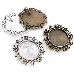 Detailed macro view of 25mm round lace bezel pendant trays in silver and bronze finish