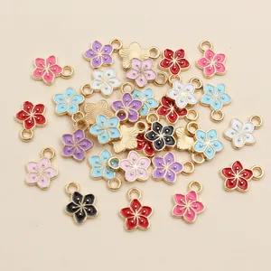 Colorful 11x9mm flower charms with gold metal edges for DIY jewelry making