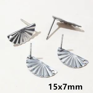 Macro shot of 15x7mm silver stainless steel geometric earrings with radial stripes