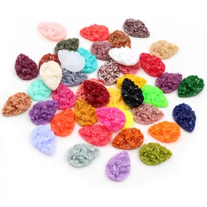 Assorted colors of teardrop resin cabochons with druzy texture for DIY crafts.