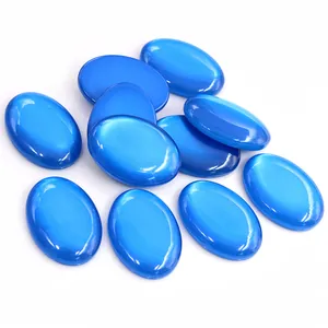 Detailed view of polished blue oval resin cabochons for DIY jewelry making