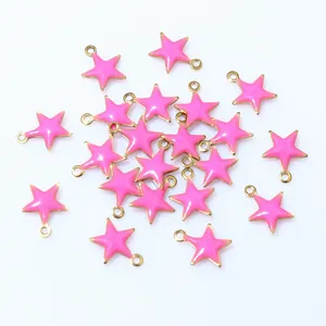 Detail showing neon pink star pendants with gold trim and top loops for DIY jewelry