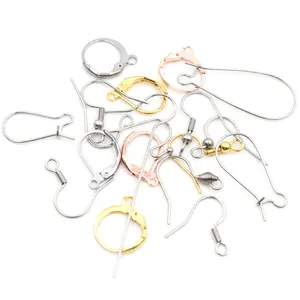Close-up of assorted stainless steel earring hooks in gold, silver, and rose gold finishes