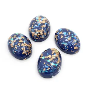 Set mit vier 18x25mm ovalen Sternenhimmel-Harzcabochons mit Goldfolie und blauem Glitzer