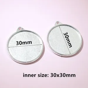 Close-up of a 30mm round silver alloy pendant base with 30x30mm inner size for DIY jewelry