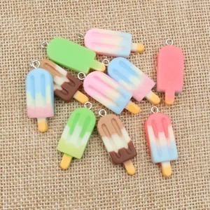 Detailed view of colorful resin ice cream pendants with silver rings for DIY jewelry making