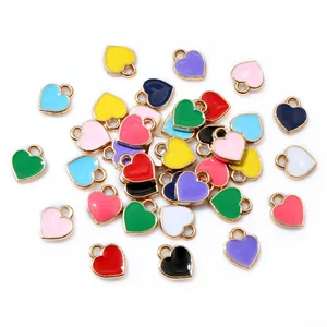 Set of ten colorful 6x8mm heart-shaped enamel charms with gold metal frames for DIY jewelry
