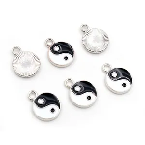 Set of yin yang pendants in silver alloy with black and white enamel for DIY jewelry