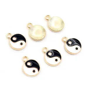 Detail of 6 piece set of Tai Chi Yin Yang enamel charms for DIY jewelry with gold metal back