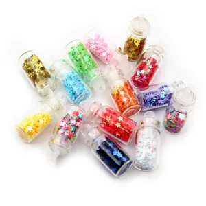 Macro view of 14 miniature bottles filled with colorful star-shaped sequins for DIY crafts
