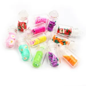 Detailed macro view of assorted miniature bubble tea bottles with colorful fruit clay slices