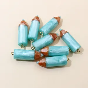 Set of 8 resin pencil-shaped pendants with blue marble texture and gold jump rings