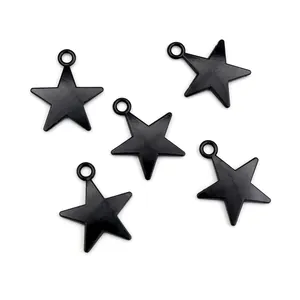 Detail shot of five black alloy star pendants with top rings for DIY jewelry making