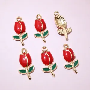 Detailed macro view showing the enamel tulip charm front and its hollow gold-tone back